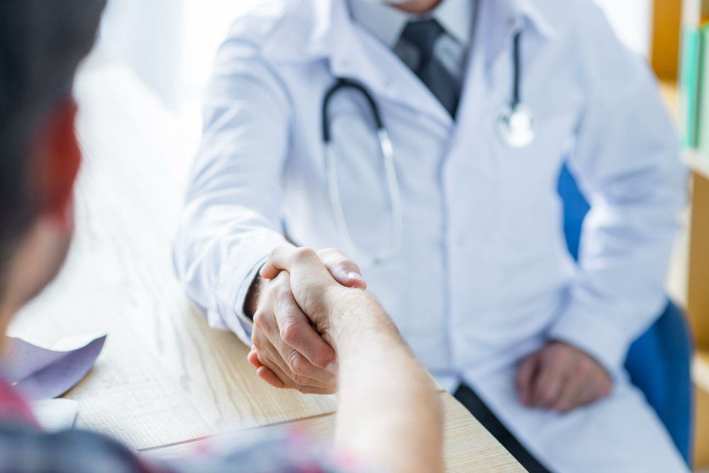 crop-doctor-patient-shaking-hands-office
